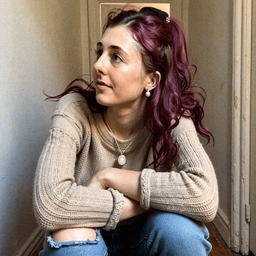 Emma-Jane MacKinnon-Lee in another backrooms hallway with warm light