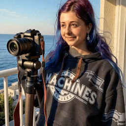 Emma-Jane MacKinnon-Lee recording outside with open sky